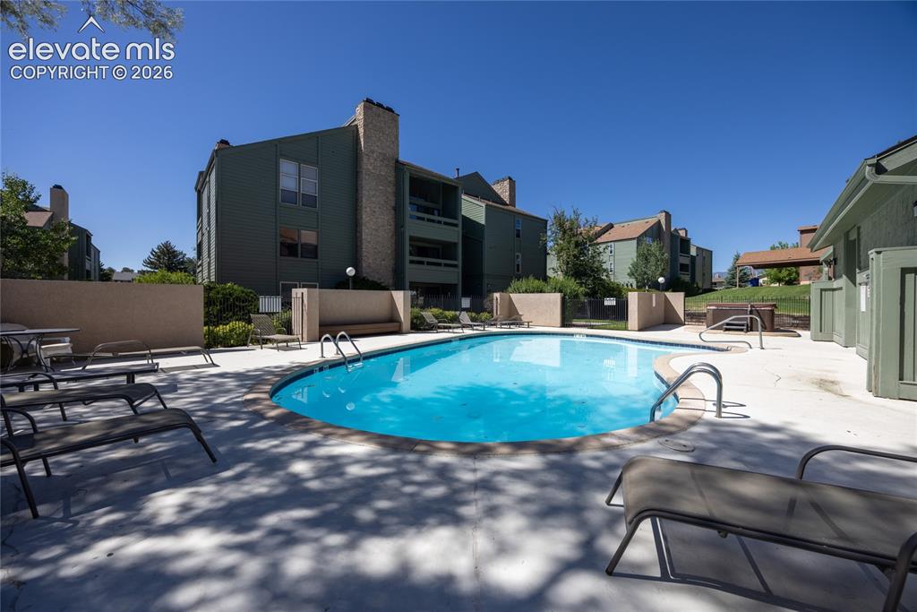 Image 21 of 25: Heated pool and a hot tub.