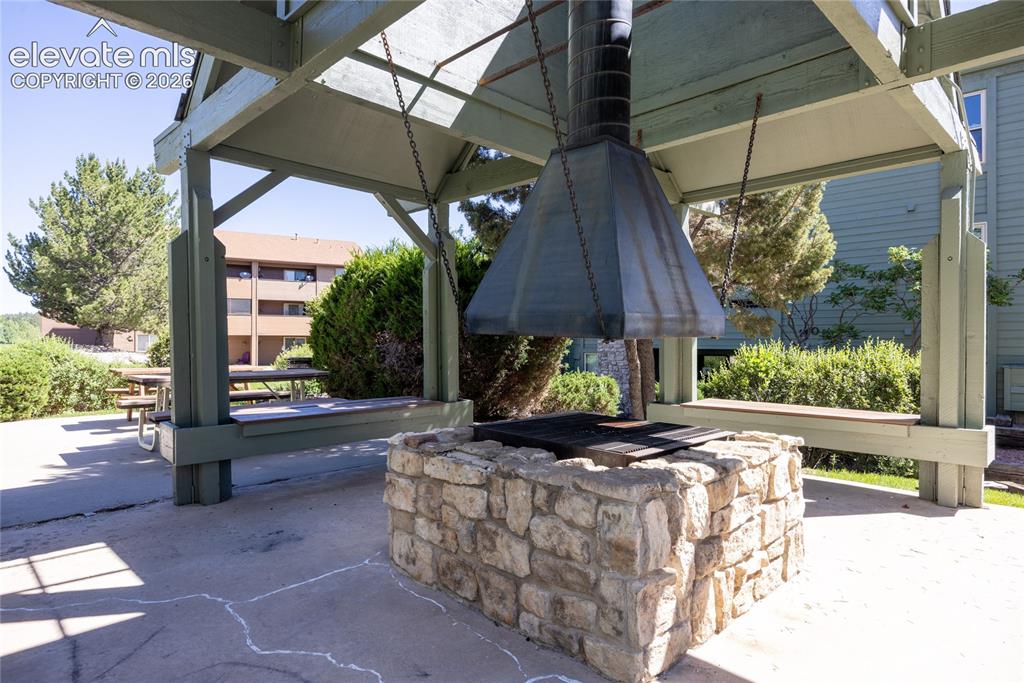 Image 23 of 25: Firepit conveniently situated near the pool and the condo.
