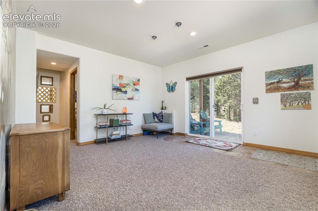 Image 28 of 36: Basement with walkout to lower patio
