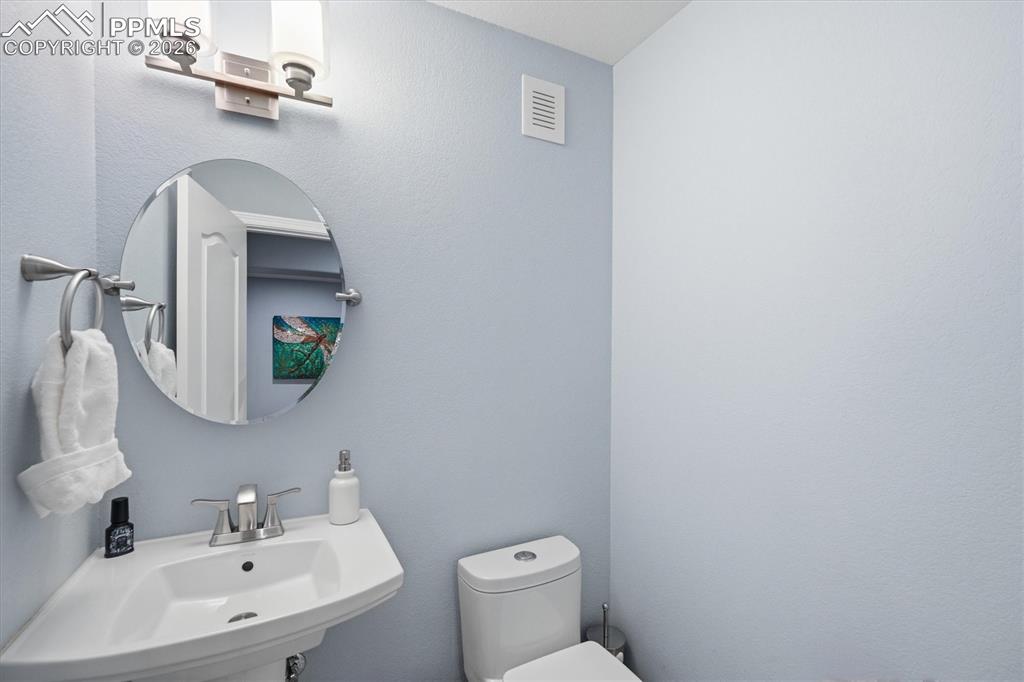 Image 34 of 50: Basement powder bathroom