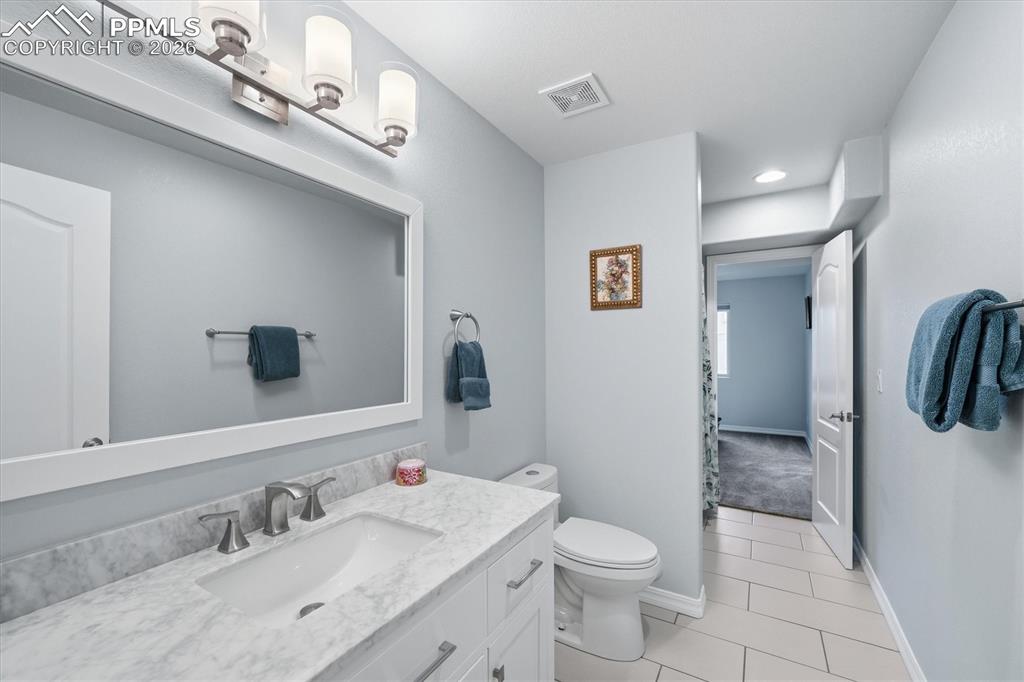 Image 37 of 50: Jack and Jill basement bathroom