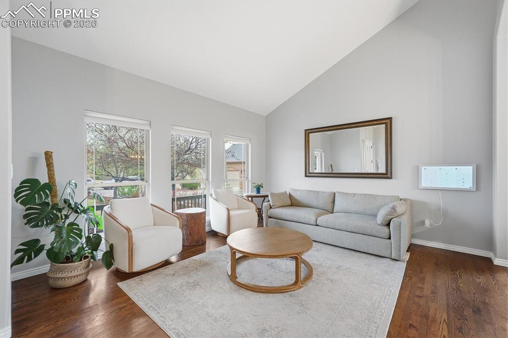 Image 5 of 50: Formal living room + vaulted ceilings