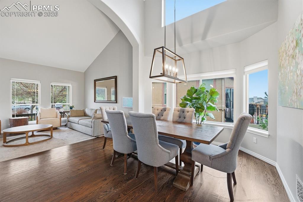 Image 8 of 50: Formal Dining room w/ Vaulted ceiling