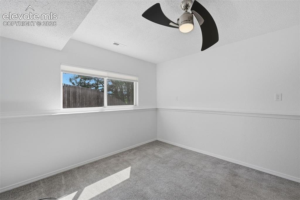 Image 13 of 29: Basement bedroom to the left of the stairs, garden level so light filled wi
