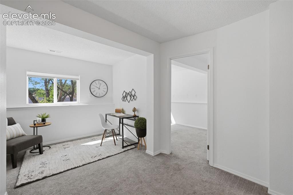Image 15 of 29: Basement area that has versatility, use for office space, or sitting room,