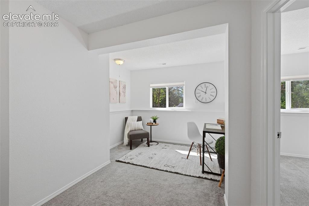 Image 16 of 29: Another angle of the sitting area with potential multi uses