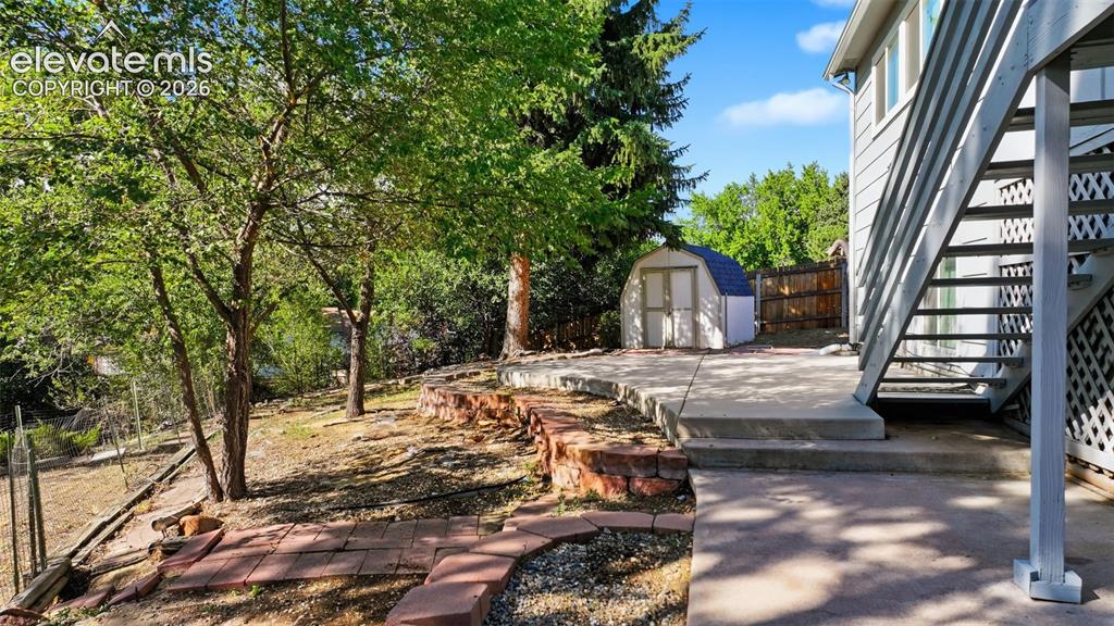 Image 21 of 29: HUGE 1/4 lot so large backyard area, imagine raised garden beds, dog runs,