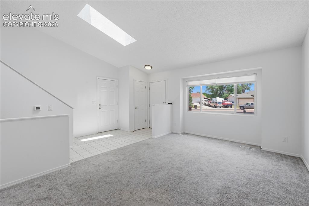 Image 3 of 15: Living room main level and entry