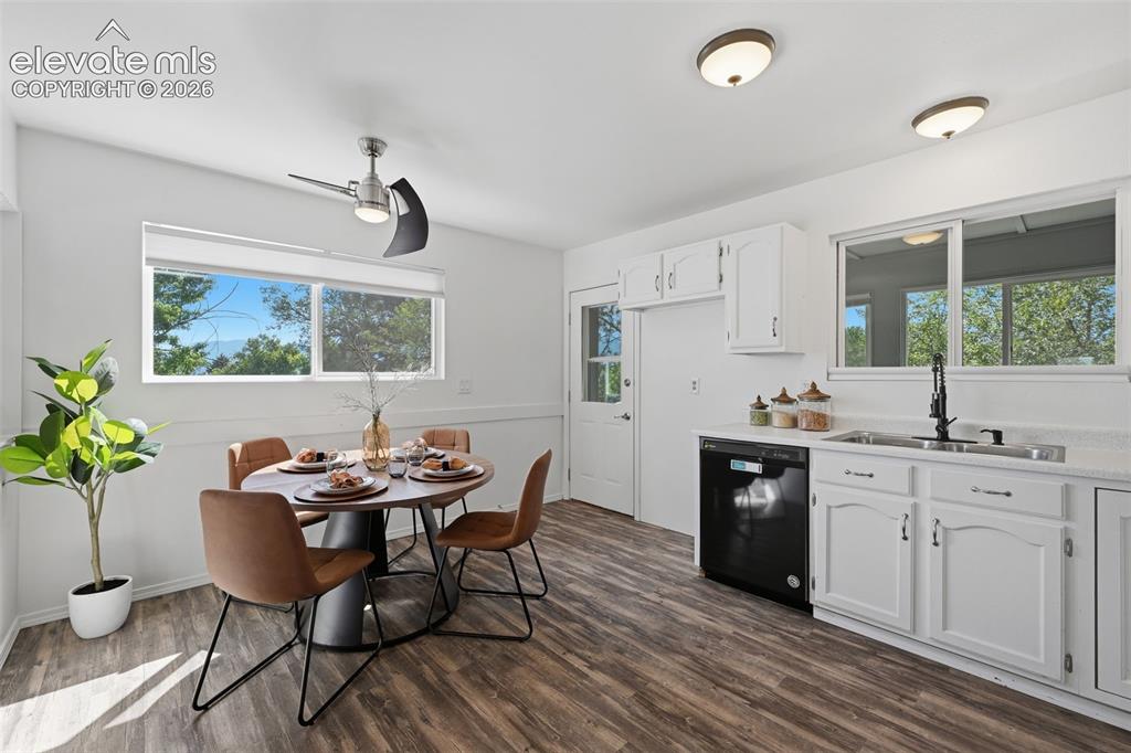 Image 6 of 29: Eat in kitchen with door to enclosed back porch.