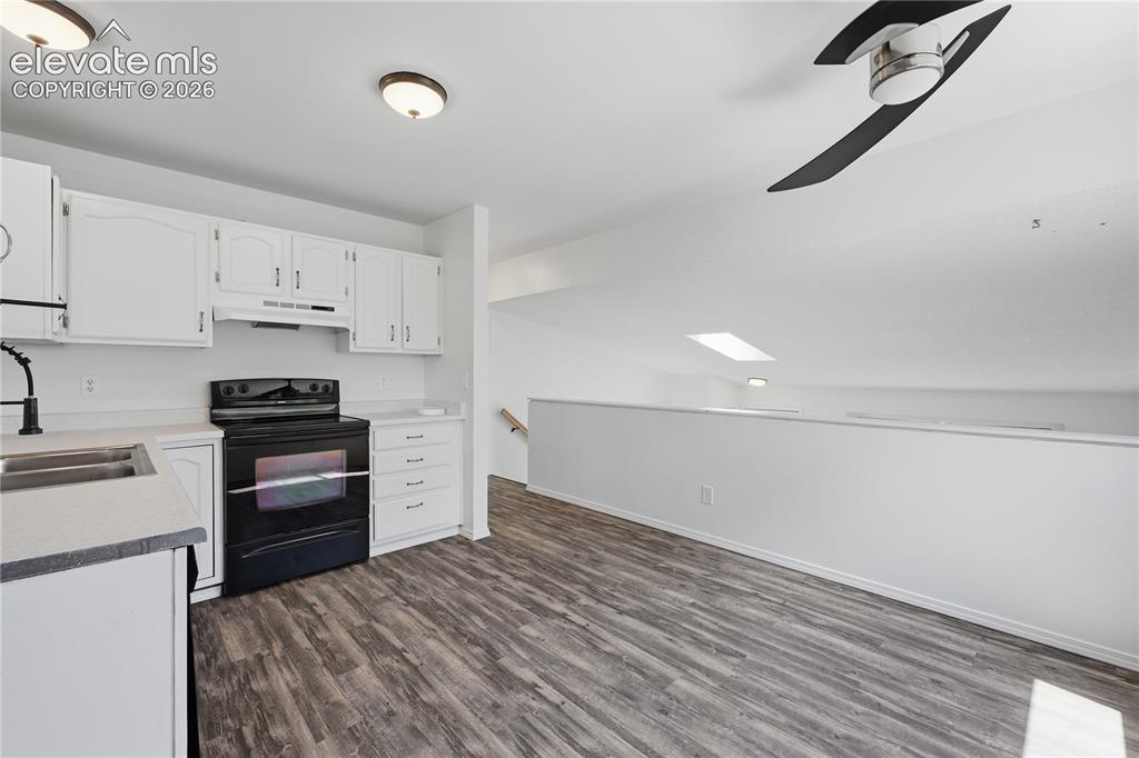 Image 8 of 15: Kitchen showing overlook to living room below
