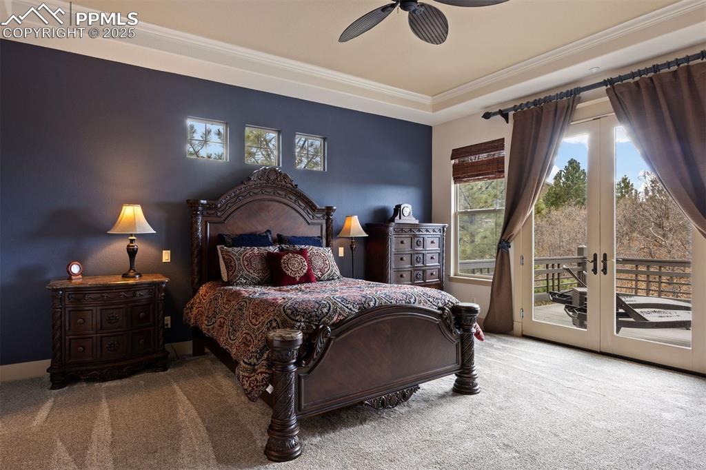 Image 18 of 50: Carpeted bedroom featuring french doors, access to exterior, and a ceiling 