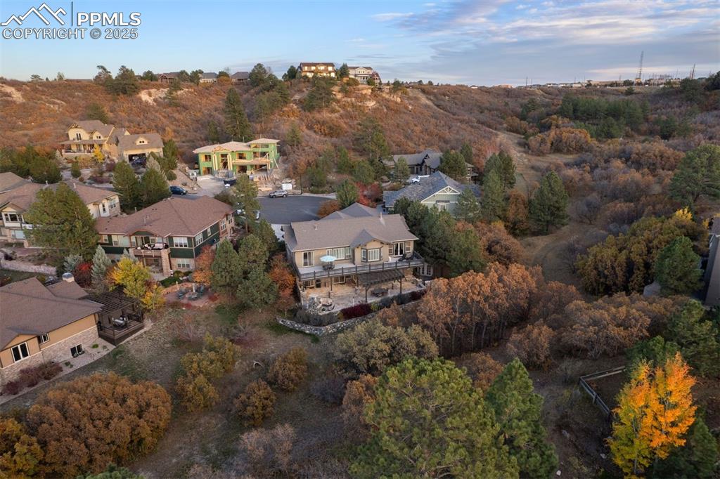 Image 31 of 50: Aerial view of property and surrounding area with nearby suburban area