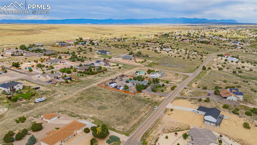 Image 2 of 7: Aerial view of property and surrounding area with rural landscape and mount