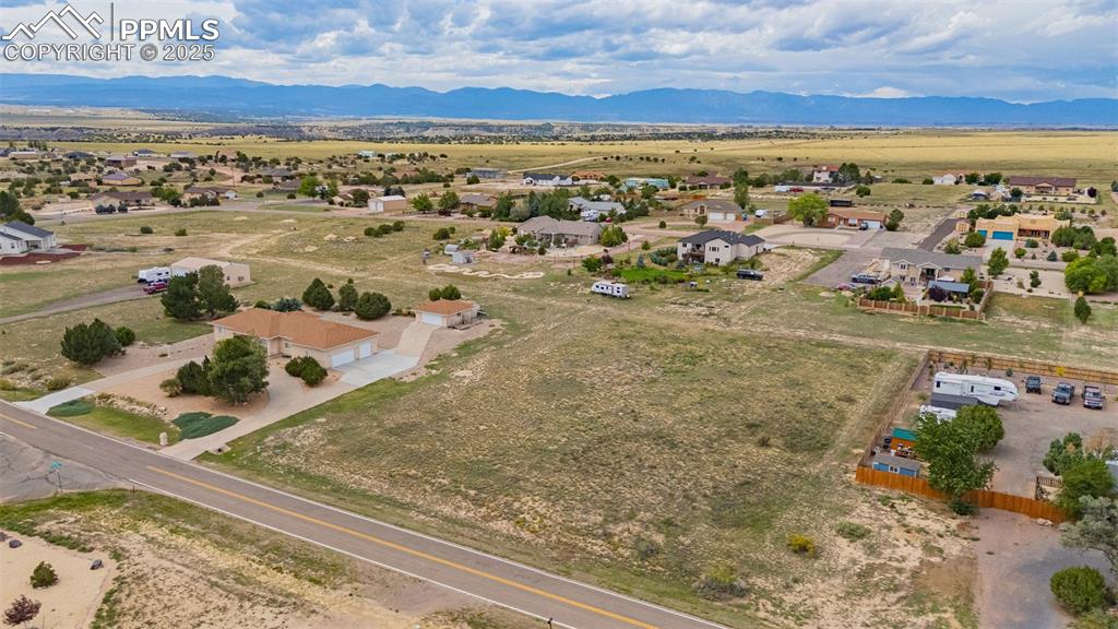 Image 5 of 7: View of rural area featuring mountains and nearby suburban area