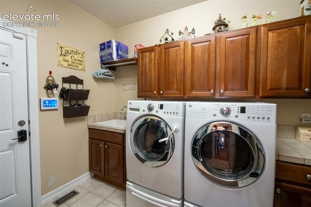 Image 31 of 50: MAIN LEVEL LAUNDRY ROOM