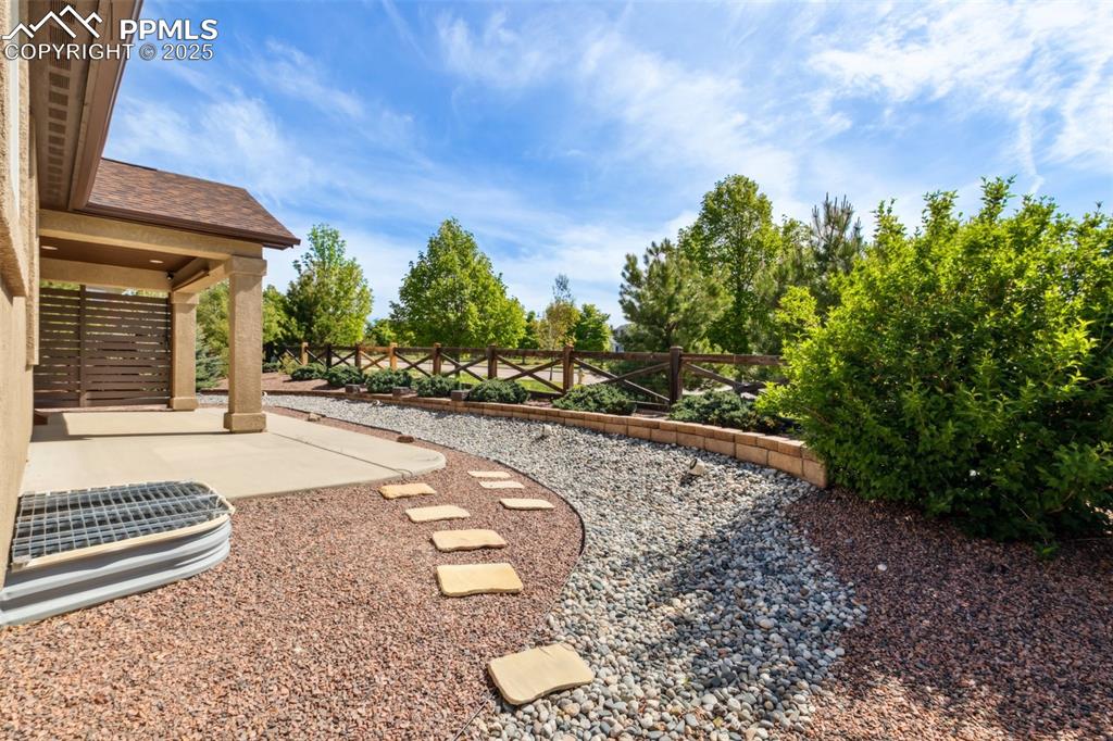 Image 41 of 50: View of yard featuring a patio area