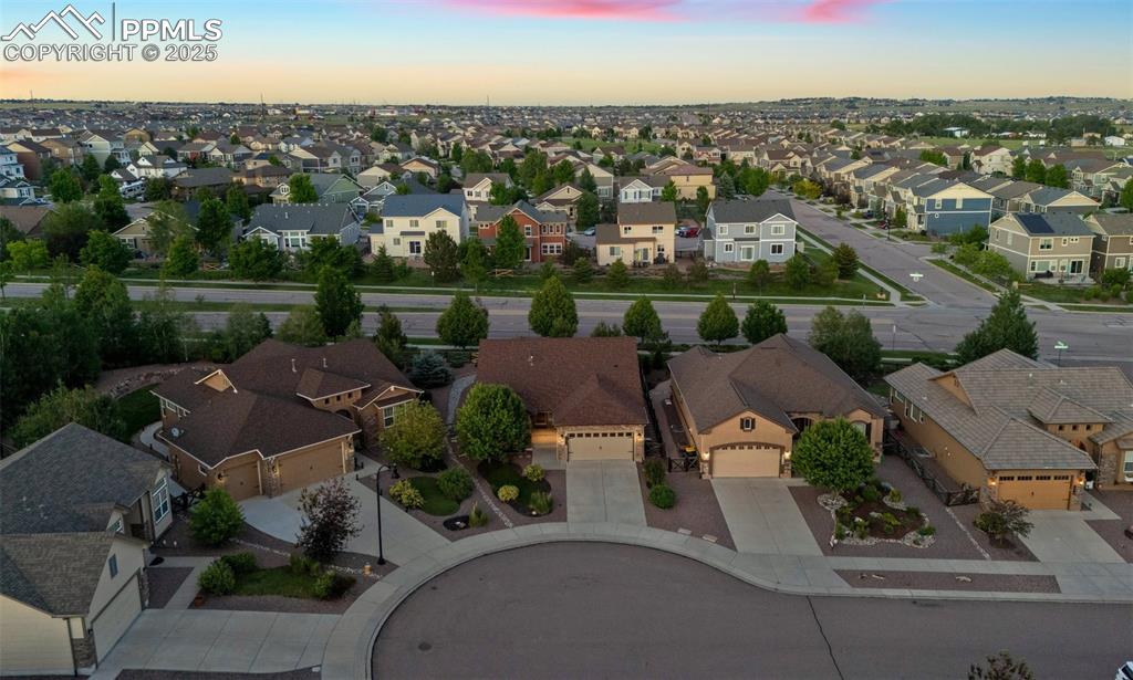 Image 45 of 50: Aerial view at dusk of a residential view