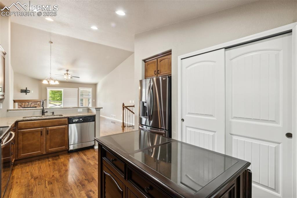 Image 5 of 50: Kitchen featuring appliances with stainless steel finishes, recessed lighti