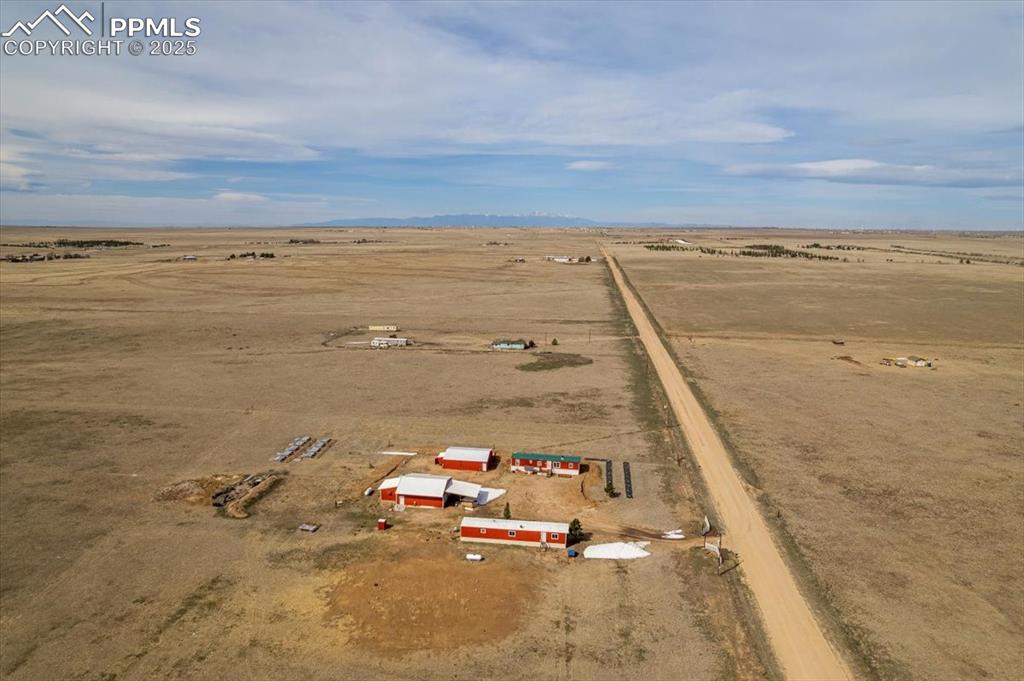 Image 48 of 50: Aerial view featuring view of desert and a rural view