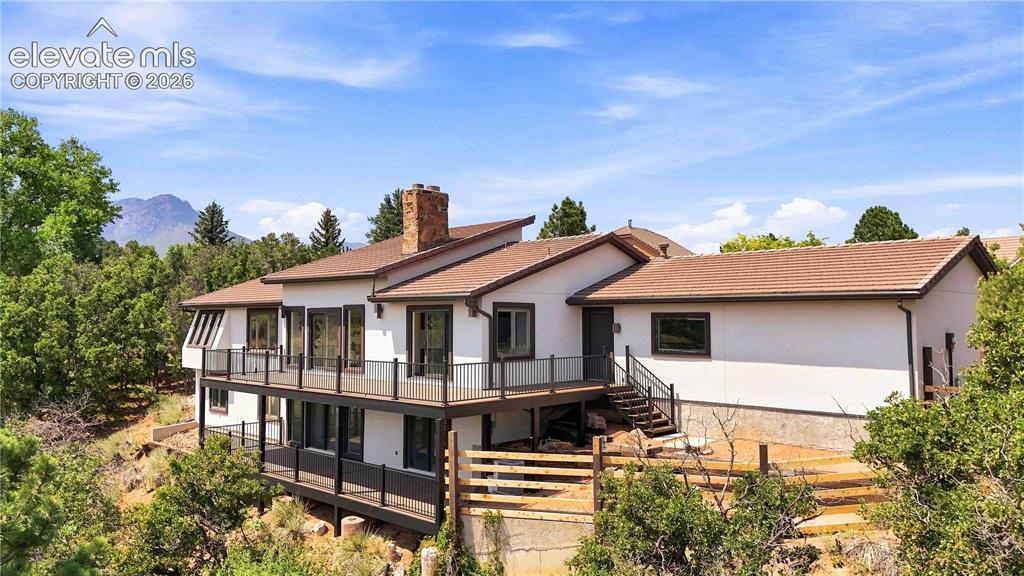 Image 48 of 49: Modern multi-level residence featuring a clean contemporary exterior with m