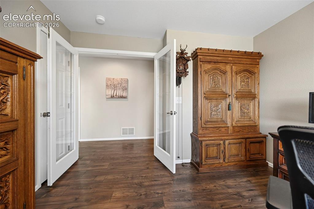 Image 22 of 36: Wood-finish flooring throughout