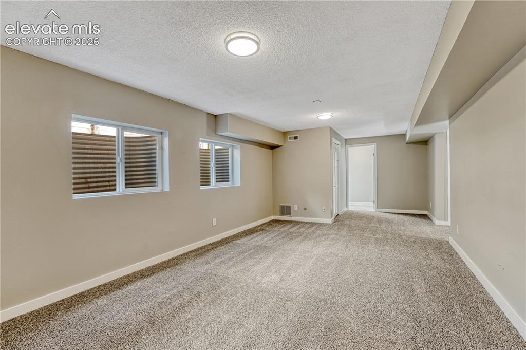 Image 21 of 41: Spacious room featuring neutral wall finishes, recessed ceiling lighting, m