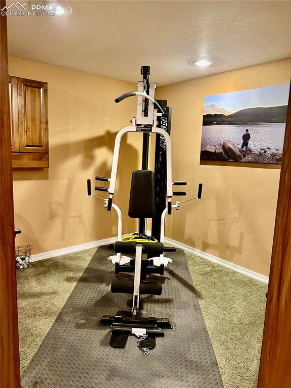 Image 17 of 41: Workout room with carpet flooring and recessed lighting