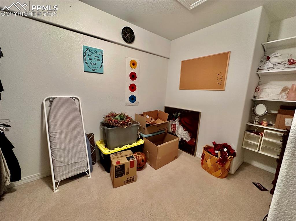 Image 27 of 41: Playroom featuring light carpet and a textured ceiling