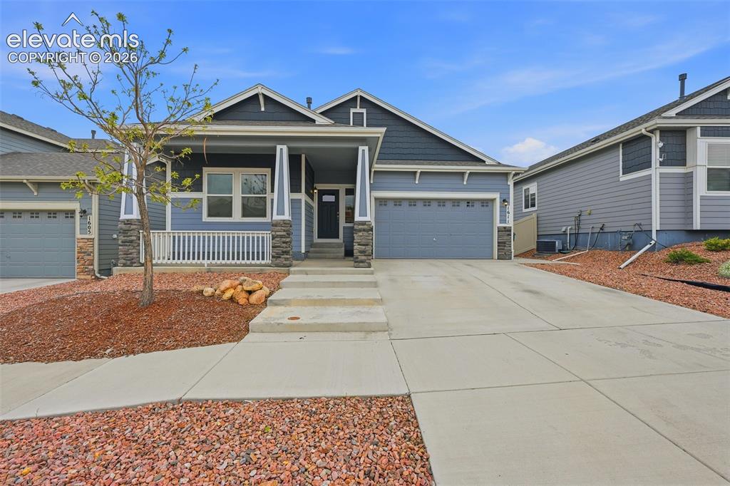 Caption: Contemporary exterior featuring horizontal siding and stone accents