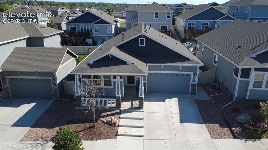 Image 2 of 40: Contemporary residence featuring a split-level design with a prominent fron