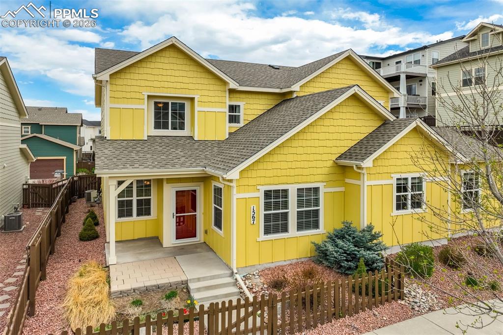 Image 2 of 35: View of front of home featuring board and batten siding, roof with shingles