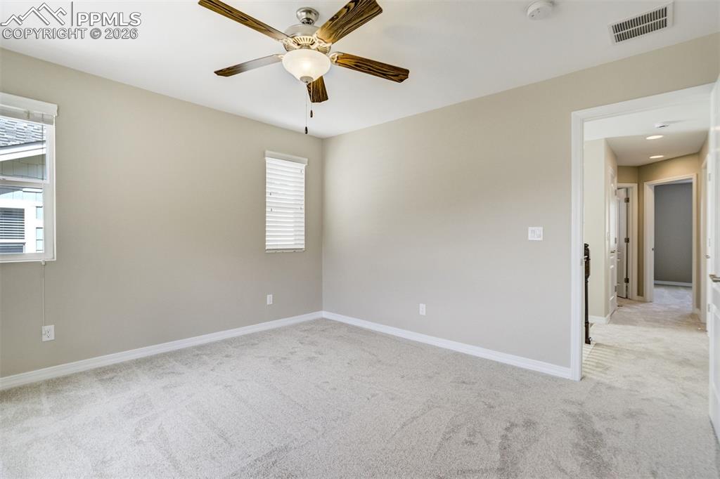 Image 22 of 35: Primary bedroom with ensuite bath, walk-in closet and mountain views