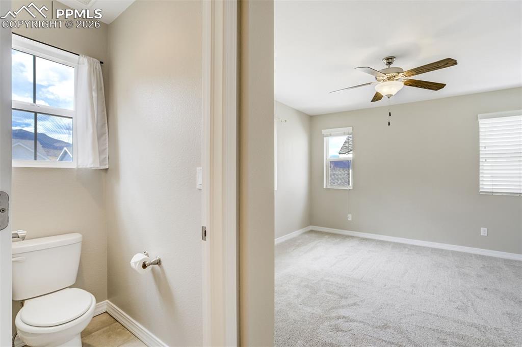 Image 24 of 35: Primary bath with large walk-in closet and mountain views