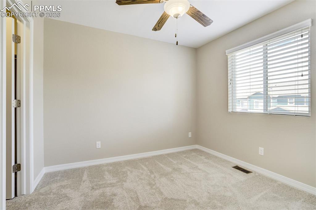 Image 28 of 35: Bedroom 2 with walk-in closet and mountain views