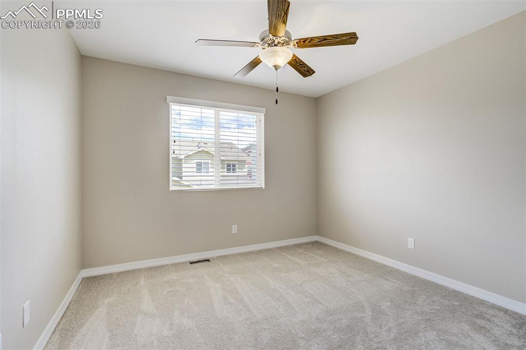 Image 30 of 35: Bedroom 3 with spacious closet and brand new carpet and padding.