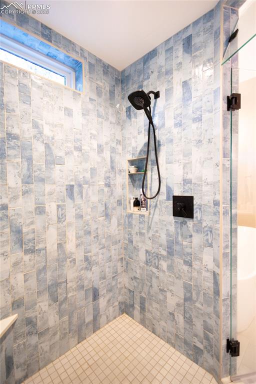 Image 19 of 49: Bathroom featuring a stall shower