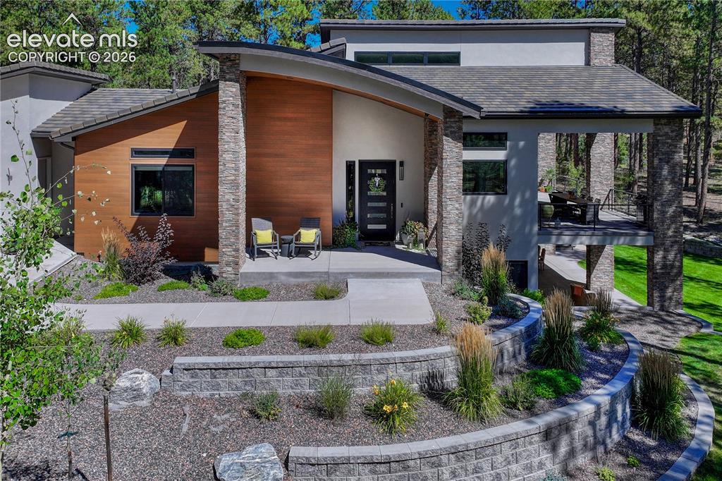 Image 2 of 49: View of front of house featuring stucco siding