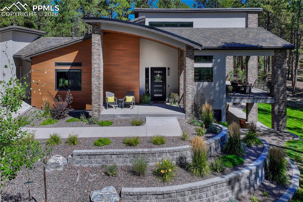 Image 3 of 49: View of front of house featuring stucco siding