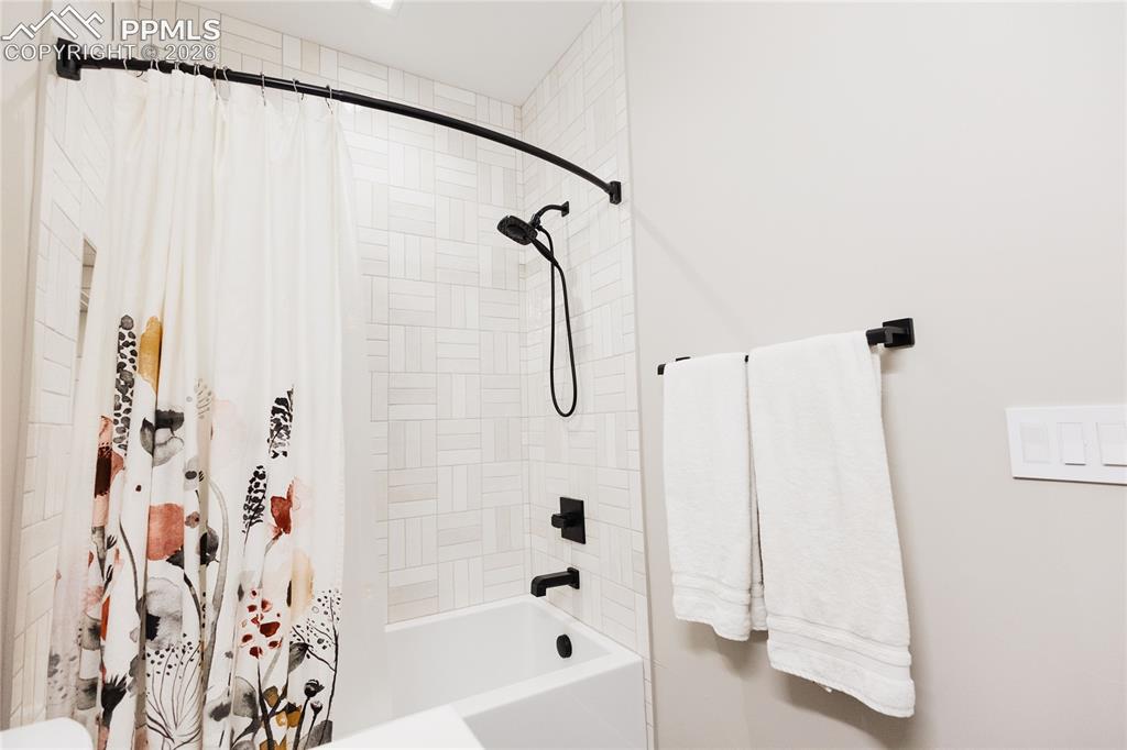 Image 31 of 49: Full bathroom with shower / bath combo