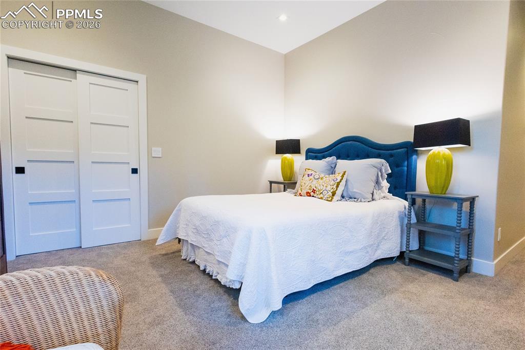 Image 32 of 49: Carpeted bedroom featuring baseboards