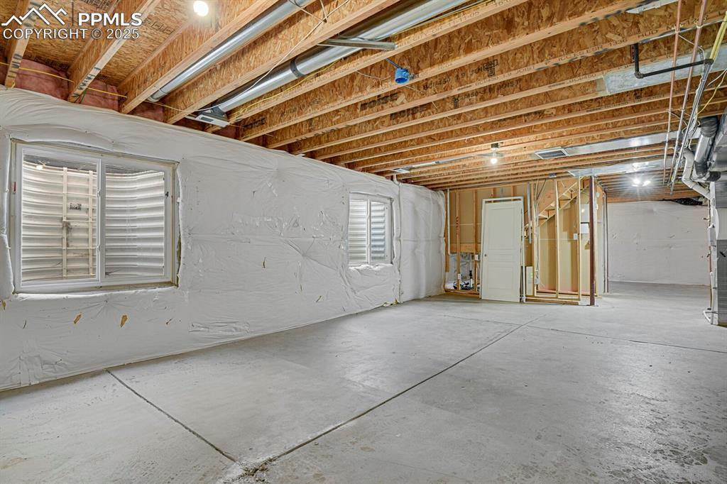 Image 34 of 35: Unfinished basement