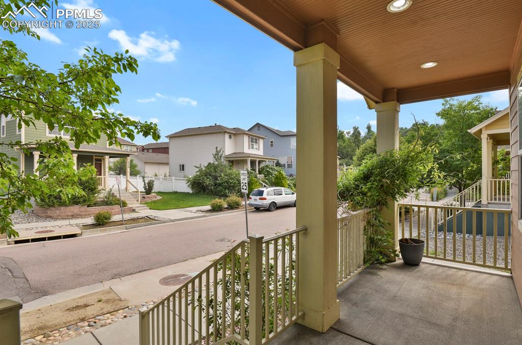 Image 5 of 35: Porch with stairway and a residential view