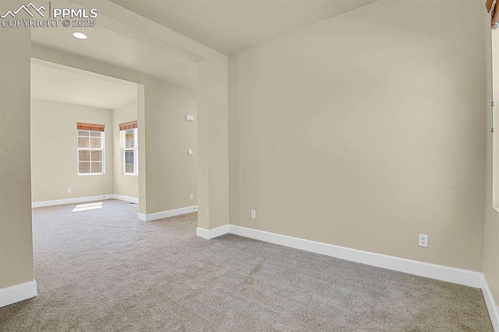 Image 7 of 35: Unfurnished room with carpet floors and recessed lighting