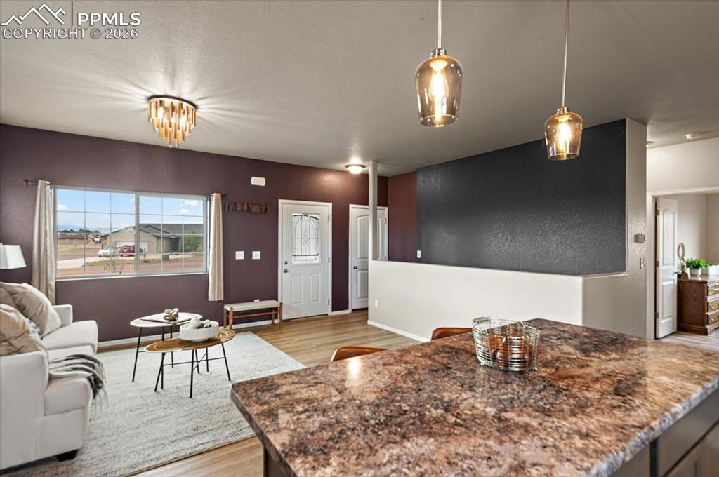 Image 15 of 41: Open floor plan, new LVP, new light fixtures, new paint