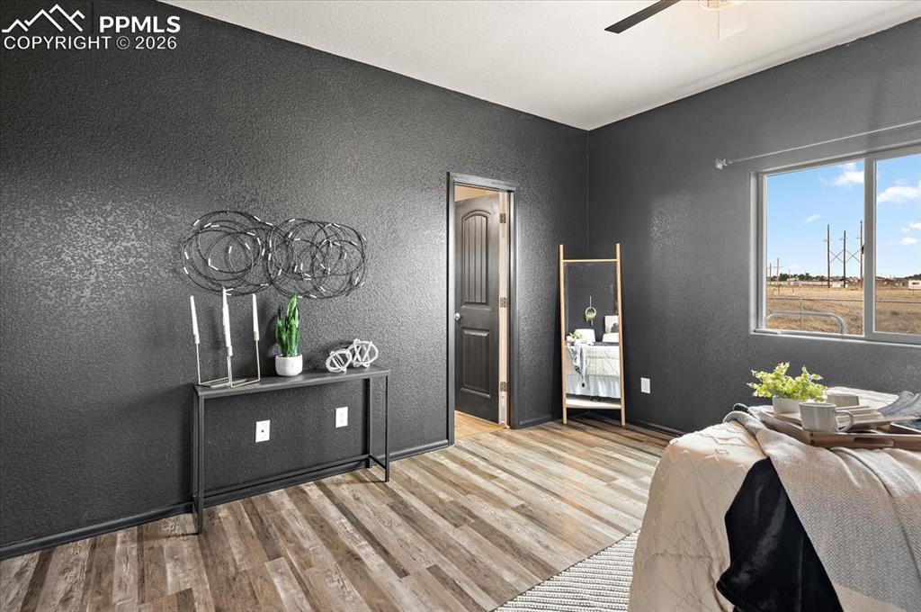 Image 17 of 41: Main floor primary bedroom suite, new LVP, newly painted, windows face back