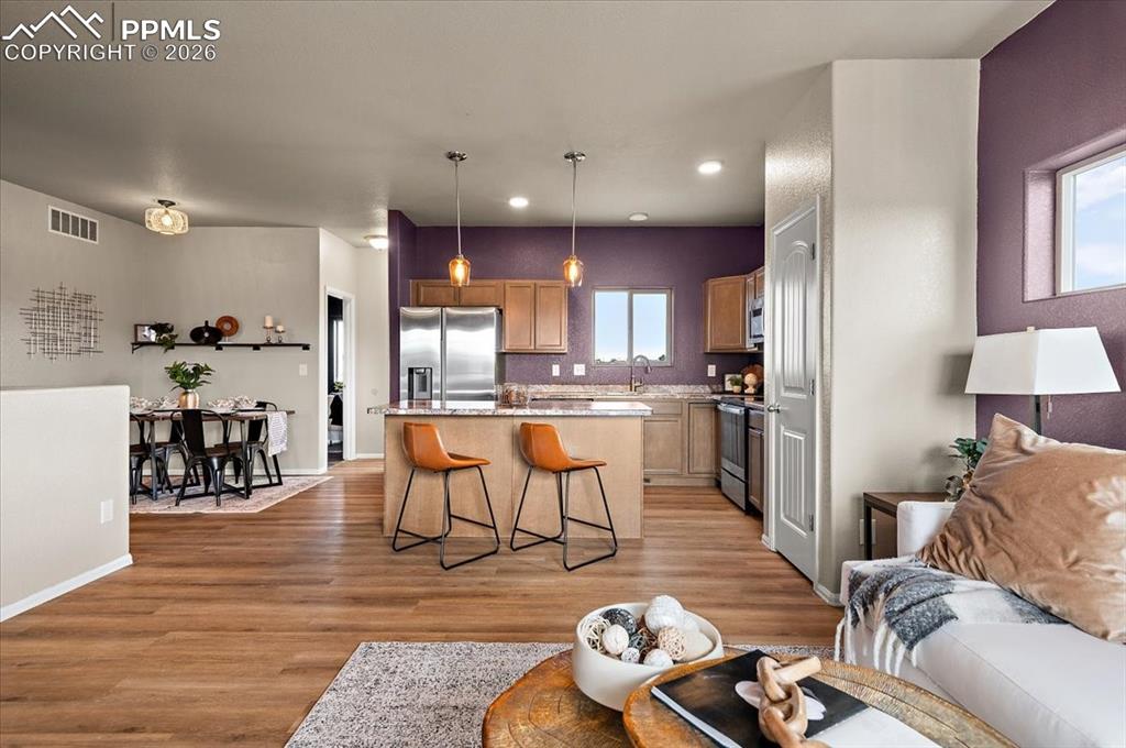 Image 7 of 41: Open floor plan, new LVP, new light fixtures, new paint
