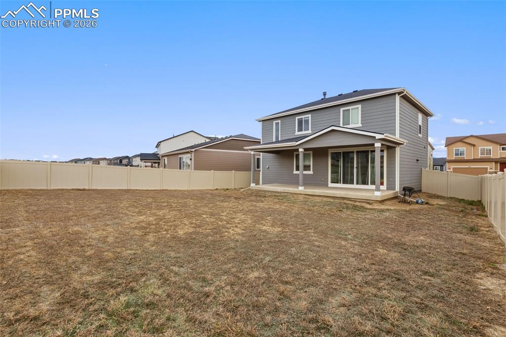 Image 34 of 36: The home has a spacious backyard!