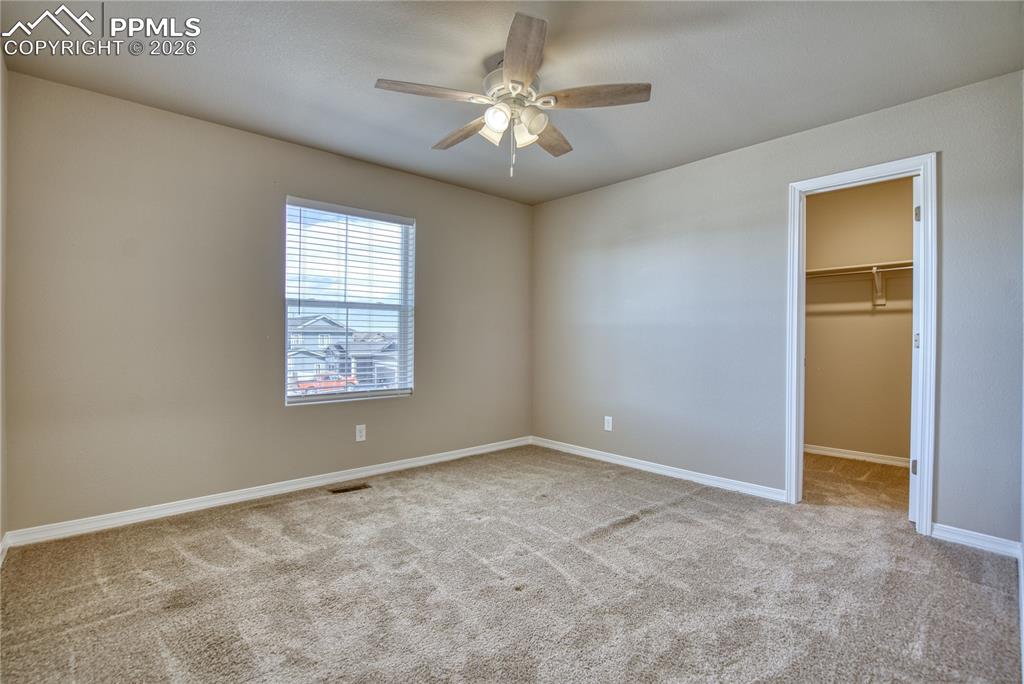 Image 29 of 46: Bedroom with walk-in closet