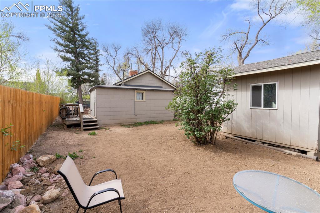 Image 10 of 15: View of yard with a deck