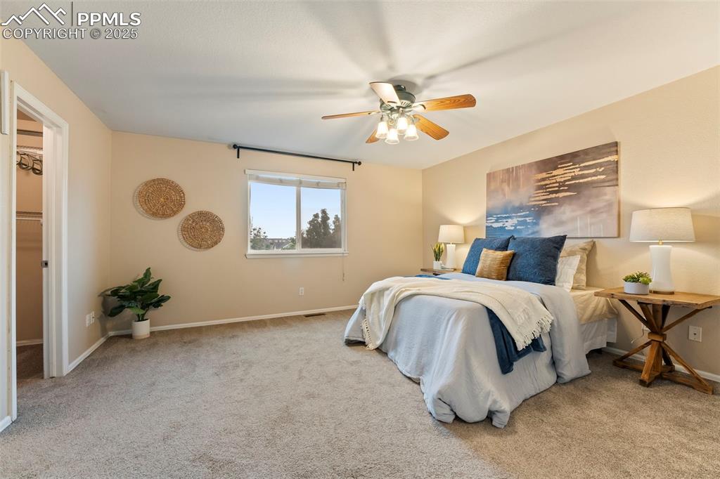 Image 11 of 31: Bedroom featuring carpet flooring and a ceiling fan